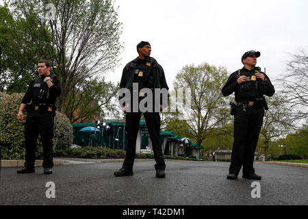 Washington, USA. 12th Apr, 2019. Secret Service agents are seen outside the White House in Washington, DC, the United States, on April 12, 2019. A man set his jacket on fire outside the White House on Friday afternoon, according to the U.S. Secret Service. Credit: Ting Shen/Xinhua/Alamy Live News Stock Photo