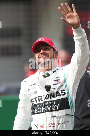 Shanghai China. 13th Apr 2019. Mercedes British driver Lewis Hamilton waves to the spectators after the