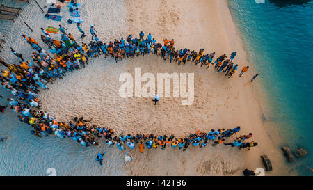 beach acrobats fun in Zanzibar Stock Photo