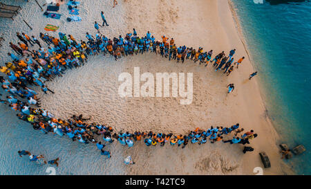 beach acrobats fun in Zanzibar Stock Photo