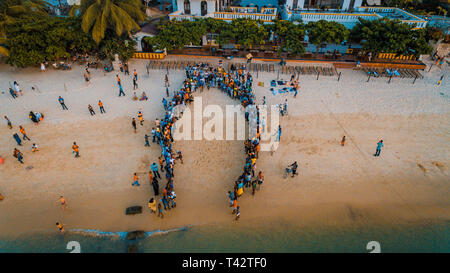 beach acrobats fun in Zanzibar Stock Photo