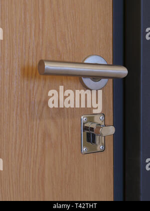 door handle and lock from the inside of the room Stock Photo