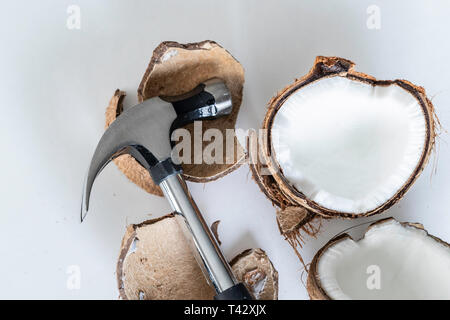 Coconut shell smashed open and into pieces with a hammer Stock Photo