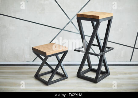 two stylish chairs made of wood and metal. photo with copy space Stock Photo