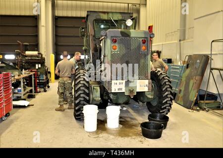 Students in the 91L10 Construction Equipment Maintenance Repairer Course work together to take an engine out of a grader Feb. 20, 2019, during training at Fort McCoy’s Regional Training Site-Maintenance facility at Fort McCoy, Wis. The completion of the course provided the students with certification in the Army’s “91-Lima” career field — construction equipment repairer. According to the Army, construction-equipment repairers are responsible for maintaining trucks, bulldozers, power shovels, and other heavy equipment needed for construction operations. Stock Photo