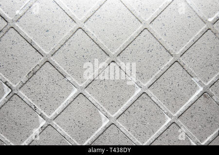 Texture of used ceramic tile back side with parts of dry glue Stock Photo