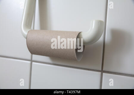 Close-up Of Finished Toilet Paper Roll In Bathroom Stock Photo