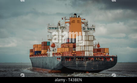 container ship on a river Stock Photo