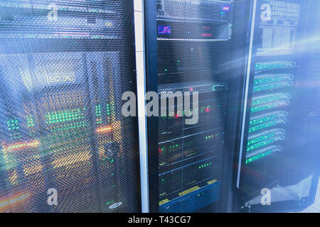 Web network, internet telecommunication technology, big data storage, cloud computing computer service business concept: server room interior in datac Stock Photo