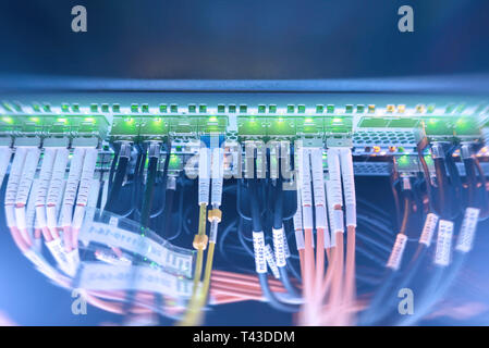 Rack Mounted Servers In A Server Room, Server rack audio cable. Severs computer in a rack at the large data center. Stock Photo