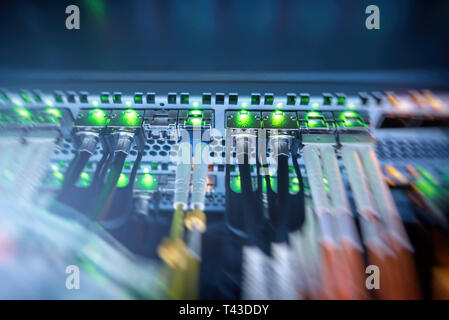 Rack Mounted Servers In A Server Room, Server rack audio cable. Severs computer in a rack at the large data center. Stock Photo