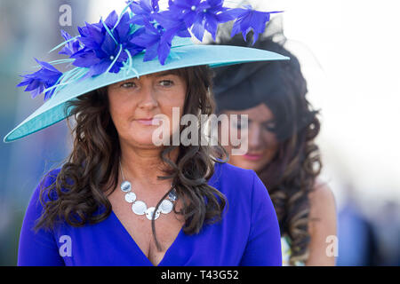 Racegoers arrive for Coral Scottish Grand National Day at Ayr Racecourse. Stock Photo