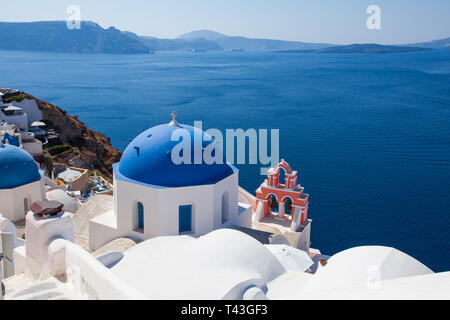 Santorini panorama. Mediterranean sea, sky, dome and white houses on coastline Stock Photo