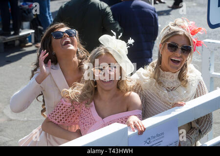 Racegoers arrive during Coral Scottish Grand National Day at Ayr Racecourse. Stock Photo