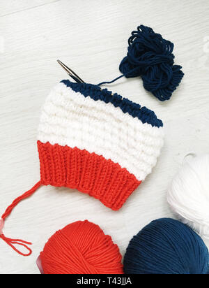 tangles with a knitting thread hat on a table Stock Photo