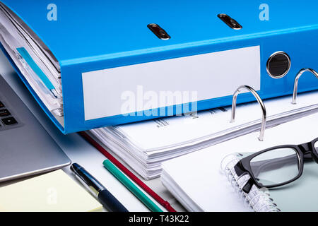 Office Workplace With Laptop And Folders On White Table Stock Photo