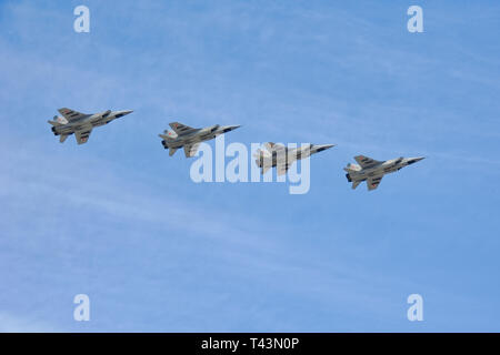 = Interceptor Aircrafts MiG-31 in the Sky over Red Square =  Four Russian long-range supersonic interceptor aircrafts MiG-31 Foxhound flying in format Stock Photo