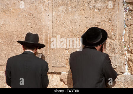 Orthodox Jews praying at the Western Wall, Jerusalem, Israel Stock Photo