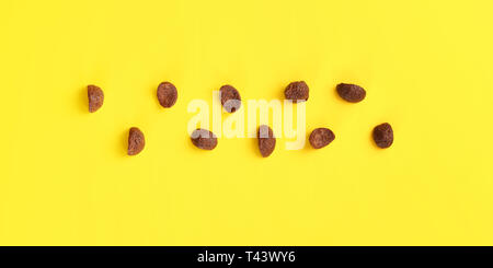 Top down view, chocolate cornflakes on yellow board. Stock Photo