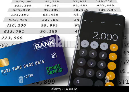 Credit card and smartphone lying on a spreadsheet background with numbers in colums. Accounting or banking concept. Stock Photo