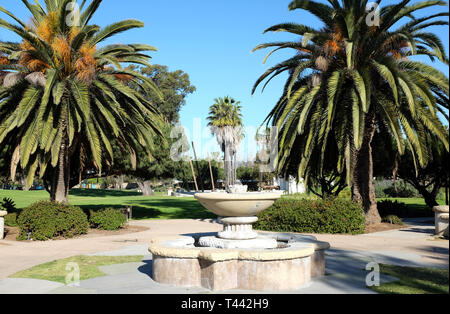SANTA BARBARA, CALIFORNIA - APRIL 11, 2019: Chase Palm Park fountain and palm trees. A public park along the waterfront with play areas, pond, picnic  Stock Photo