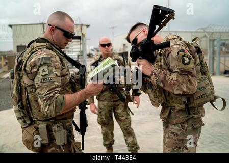 U.S. Army Sgt. Royce Fletcher, left, and Spc. Jonathan Sherwin, right ...