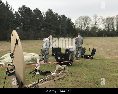 Members of the 263rd Combat Communications Squadron participate in the Combat Communications (CBC) Rodeo while at Robins Air Force Base, Georgia, Mar. 13, 2019. The CBC Rodeo is a Nationwide training exercise that brings together Combat Communications Squadrons from across the country to train in techniques and skills while networking to increase the potential success of future deployments. Stock Photo