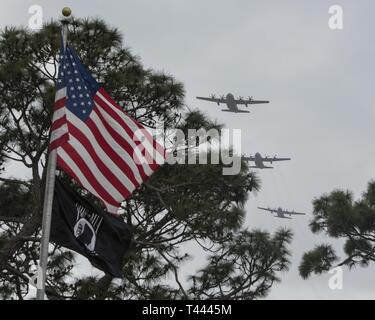 An AC-130J Ghostrider gunship with the 73rd Special Operations Squadron, AC-130U Spooky with the 4th SOS and an AC-130W Stinger II with the 16th SOS, Cannon Air Force Base, New Mexico, fly over the Jockey-14 25th Anniversary Memorial Ceremony at Hurlburt Field, Florida, March 14, 2019. Jockey-14 experienced an in-flight explosion, which killed eight of the 14 aircrew members who were supporting Operation Continue Hope II in Somalia. Stock Photo