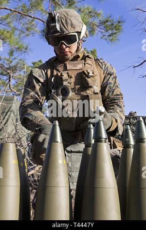 M795 Nosed Part Drawing A field artillery cannoneer prepares an M795 high explosive projectile ...
