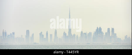 Stunning panoramic view of the Dubai skyline with the magnificent Burj Khalifa and many others towers, skyscrapers and buildings. Stock Photo