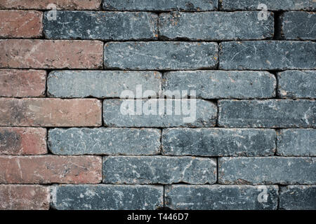 brick wall background  - tiled black and red bricks  - Stock Photo