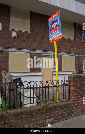 Condemned house for sale to be refurbished in run-down council housing estate in east London,England,UK Stock Photo