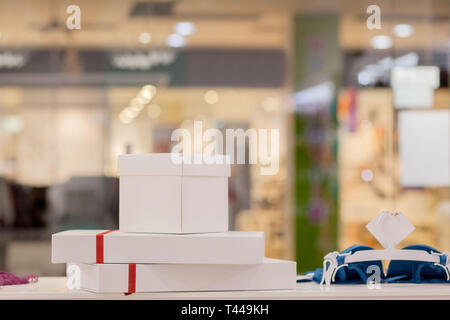 Various colorful cute gift boxes on display in store. Birthday, Christmas, Valentine day gifts. Getting ready for holidays, sale concept. Stock Photo