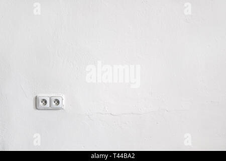 Empty white wall space for text images with two power sockets Stock Photo