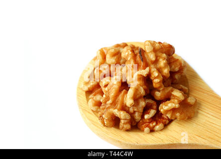 Closed up Raw Walnut Kernels on Wooden Ladle Isolated on White Background Stock Photo