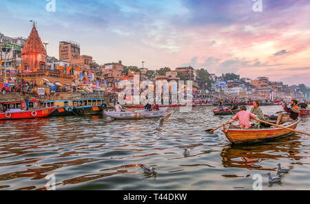 Dashaswamedh Ganges river ghat Varanasi India at twilight with tourists enjoying boating rides Stock Photo