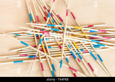 wooden sticks of Mikado pick-up sticks game close up on wood board Stock Photo