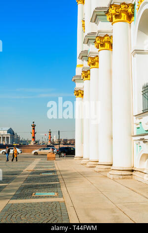 St Petersburg, Russia - April 5, 2019. Columns of Winter Palace and Hermitage Museum Building and Vasilievsky island spit on the background. St Peters Stock Photo