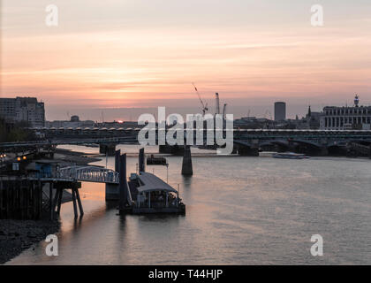 London sunset at riverside area with bridge view and dramatic sky Stock Photo