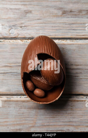 Chocolate easter eggs on a rustic wooden background Stock Photo
