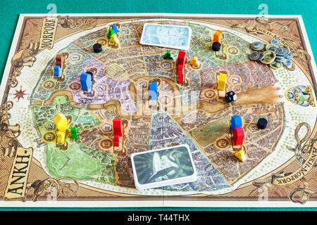 MOSCOW, RUSSIA - APRIL 3, 2019: gameplay of Discworld: Ankh-Morpork board game. This game was designed by Martin Wallace and Treefrog Games, and first Stock Photo