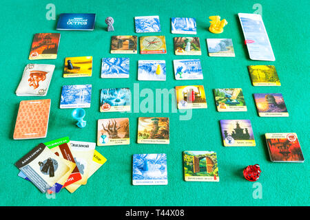 MOSCOW, RUSSIA - APRIL 3, 2019: gameplay of Forbidden Island cooperative board game (russian edition). The game was developed by Matt Leacock and publ Stock Photo
