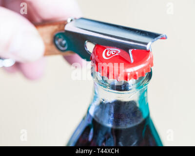 https://l450v.alamy.com/450v/t44xch/moscow-russia-april-4-2019-opening-a-coca-cola-glass-bottle-by-bottle-opener-close-up-coca-cola-coke-is-carbonated-soft-drink-manufactured-by-t44xch.jpg