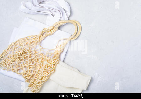 Cotton and Mesh Bags, Zero Waste Concept, Eco Friendly Shopping Bags over Grey Background Stock Photo