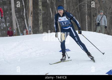 Athletes compete in the 2019 Chief, National Guard Bureau Biathlon Championship Sprint Race, Camp Ethan Allen Training Site, Jericho, Vt., Feb. 24, 2019. The CNGB Championships consist of the sprint, pursuit, patrol, and relay race. Stock Photo