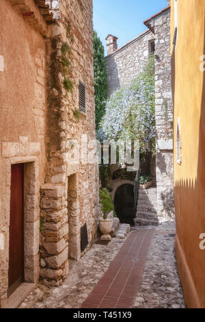 Eze, France, September 5, 2018:  The entrance to the Chateau Eza restaurant in a narrow street in the old center of the  picturesque medieval village  Stock Photo