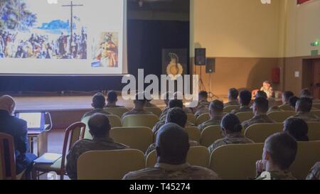 Świętoszów, Poland (Feb. 26, 2019) - Soldiers from the 1st Squadron, 4th U.S. Cavalry Regiment out of Fort Riley, Kan., watch and take notes on the Polish history presentation given by Maj. Zbigniew Zielonka, PhD and Cmdr. Krzysztof Ruminski. The history lesson covered major events from Poland’s 1000 years of history. Stock Photo