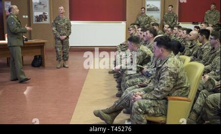 Świętoszów, Poland (Feb. 26, 2019) - Soldiers from the 1st Squadron, 4th U.S. Cavalry Regiment out of Fort Riley, Kan., listen to the final remarks from Maj. Zbigniew Zielonka, PhD. after the main history presentation. The history lesson covered major events from Poland’s 1000 years of history. Stock Photo