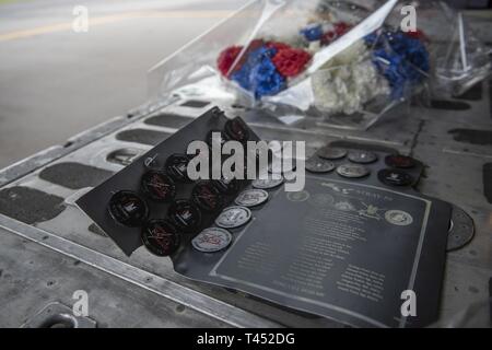 A memorial plaque sits on the ramp of a 1st Special Operations Squadron MC-130H Combat Talon II before a memorial flight Feb. 26, 2019, at Kadena Air Base, Japan. The memorial flight took place off the coast of the Philippines and was in honor of those who were lost when a 1st SOS MC-130E Combat Talon I, call sign STRAY 59, crashed 38 years ago during an exercise, killing eight crew member and 15 passengers. Stock Photo