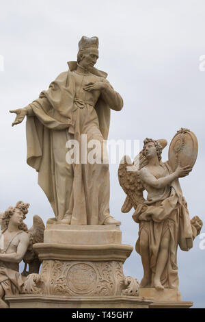 Baroque statue of Saint Francis Borgia surrounded by angels by Czech sculptor Ferdinand Maxmilián Brokoff on the Charles Bridge in Prague, Czech Republic. The current statue on the bridge is a copy dated from 2018-2019 after an original dated from 1710. Stock Photo